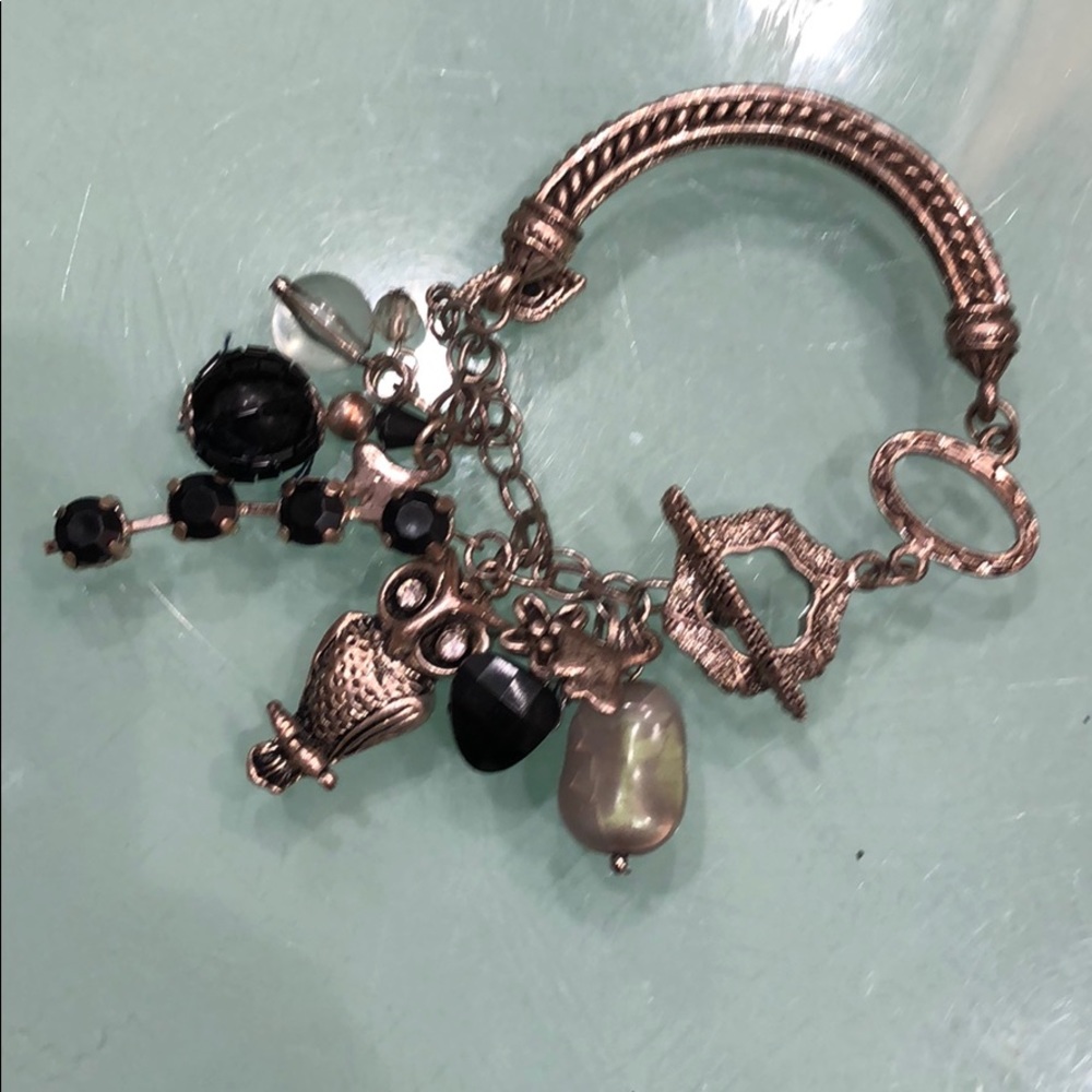Charm bracelet with owls and stones